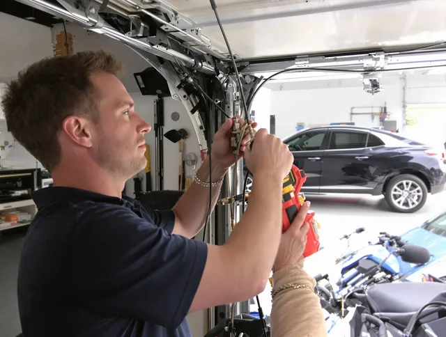 Westborough Garage Door Repair safety certified technician performing cable replacement in Westborough